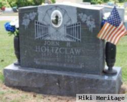 John H Holtzclaw