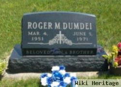 Roger M Dumdei