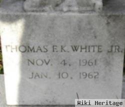 Thomas F K White