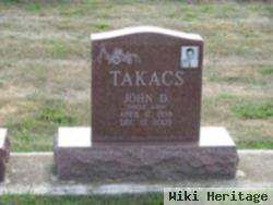 John D Takacs