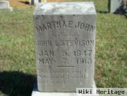 Martha E John