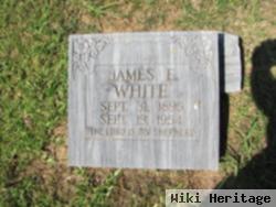 James E White