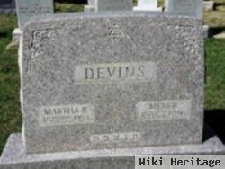 Martha B Devins