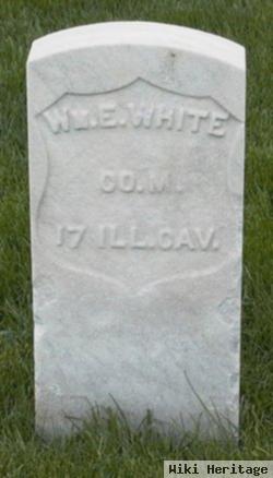 William E White