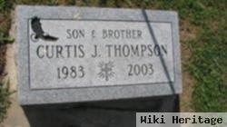 Curtis J Thompson