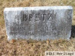 John E Bretz