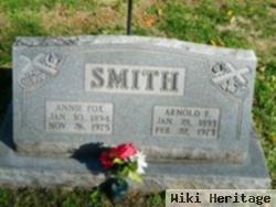 Arnold E Smith