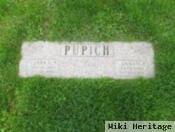 John L Pupich