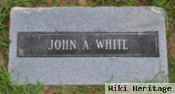 John A White