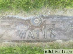 Neil E Watts