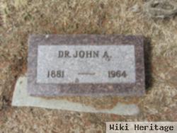 Dr John A Guttery