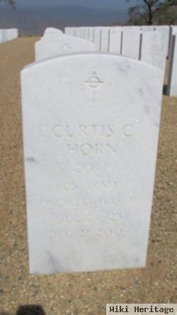 Corp Curtis C Horn