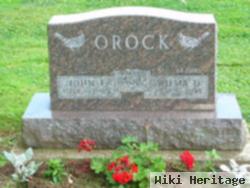 John E Orock