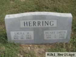 Laura M Herring