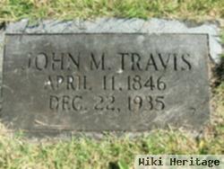 John M Travis