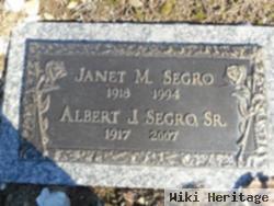 Janet M Segro