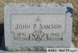 John P Samson