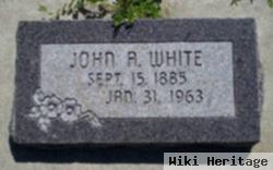 John A White