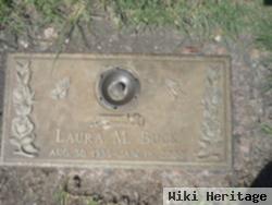 Laura M Buck