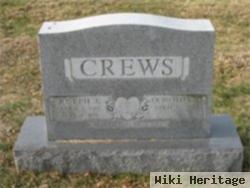 Joseph E Crews