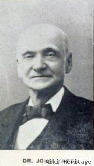 Dr John J Yates