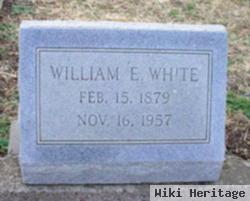 William E White