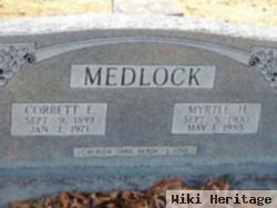 Corbett E Medlock