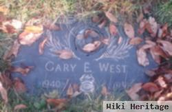 Gary E West