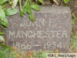 John F Manchester