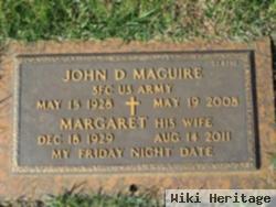 John D Maguire