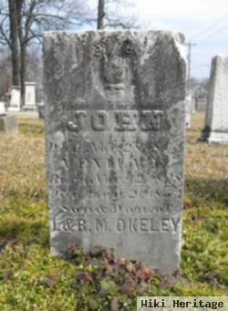 John S Okeley