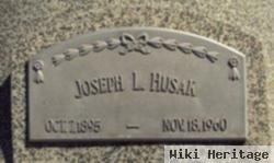 Joseph L Husak