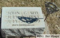 Dr John G. Woodin