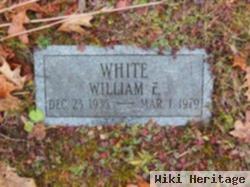 William E White