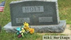 Carl W Holt