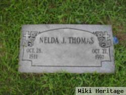 Nelda J Thomas