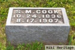 S M Cook