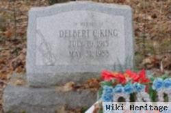 Delbert C King