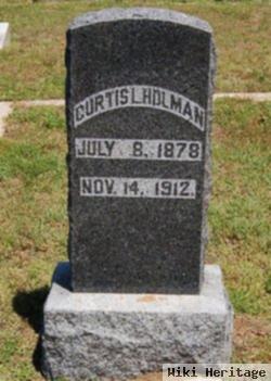 Curtis L Holman