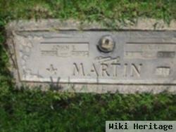 John E Martin