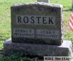 John P Rostek