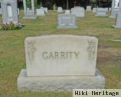 John E Garrity