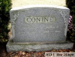 John E Conine