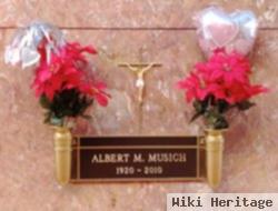 Albert M Musich