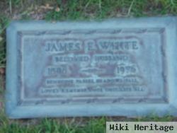 James E White