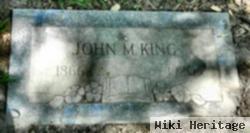 John M King