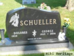 George J Schueller