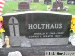 Earl L Holthaus