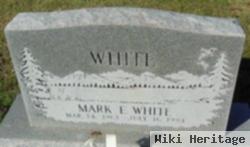 Mark E White