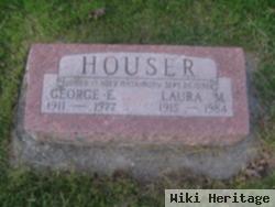 Laura M Houser